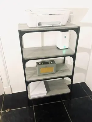 a shelf with a scale and a printer on it at Gleddoch Coach House in Langbank