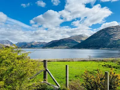 a view of a lake with mountains in the background at Avoca Lodge in Fort William