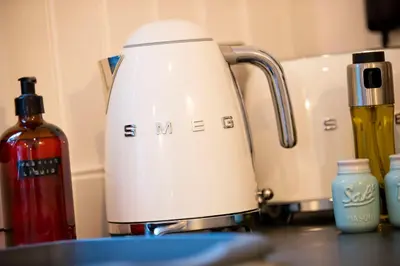 a white blender sitting on top of a counter at The Mar Huts - The Lomond Hut in Drymen