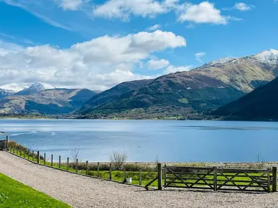 a view of a lake with mountains in the background at Avoca House in Fort William