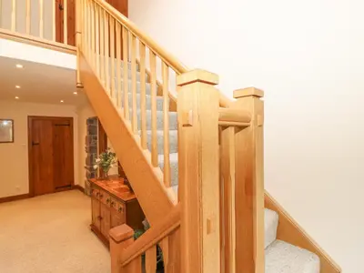 a wooden staircase in a home with aoyer at Glen View in Dumfries