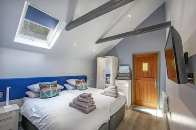 a bedroom with a bed with towels on it at Dundonald Landing Palms 2 in Oban