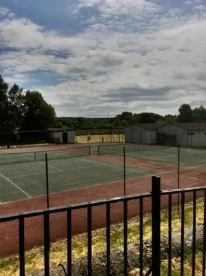 a tennis court with two tennis courts at Keppochhill - Beautiful Home with Hot Tub in Banton
