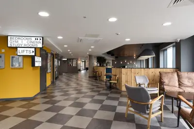a lobby with a checkered floor and chairs at Student Only Ensuite Room in Central Glasgow in Glasgow