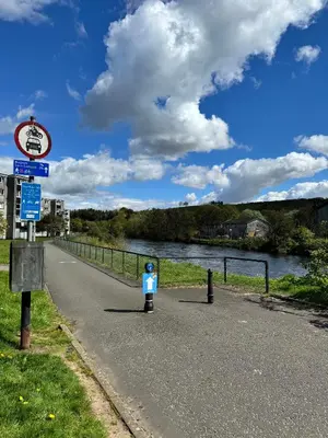 a parking meter on the side of a road next to a river at Ben Lomond Apartment - Macaulay Letting in Alexandria