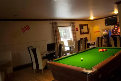 a billiard room with a pool table in it at Dalgair House Hotel in Callander