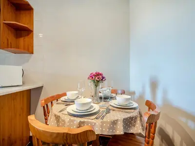 a dining room table with a polka dot table cloth at Kilbride Cottage-Uk46886 in Kilmory