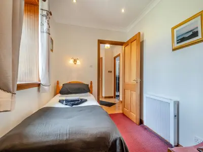 a bedroom with a bed in a room at Eryb Cottage - Uk46883 in Kilmory