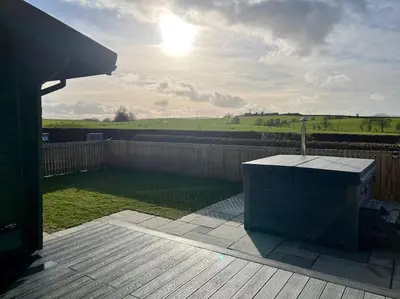 a view of a backyard with a wooden fence at The Lodge at Blackhill Farm in Carluke