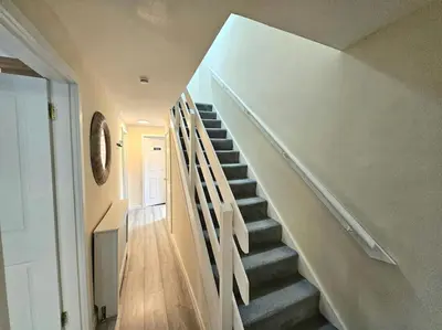 a stairway in a home with a stair case at 4 bed house With 6 Beds in Edinburgh