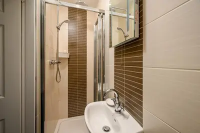 a bathroom with a sink and a shower at Adam Drysdale House in Edinburgh