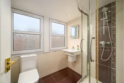 a bathroom with a shower and a toilet and a sink at Adam Drysdale House in Edinburgh
