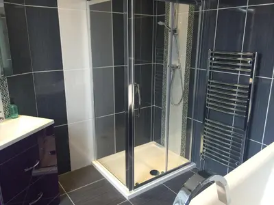 a shower with a glass door in a bathroom at Adam Drysdale House in Edinburgh
