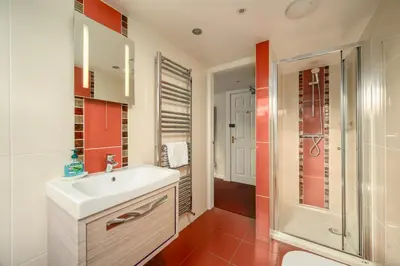 a bathroom with a sink and a shower at Adam Drysdale House in Edinburgh