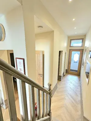a staircase in a home with a stair case at Newly Renovated Gem - Free Parking & Modern Comfort in Glasgow