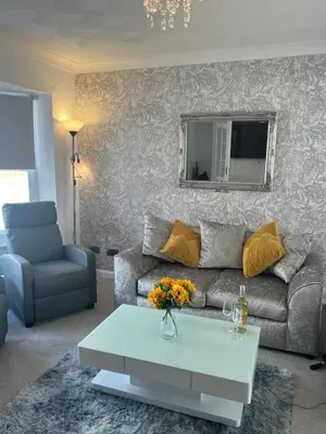 a living room with a couch and a table at No 6, Ayr, 140m2, New Decor 2024, 3bedroom, detached house, with private gardens in Ayr
