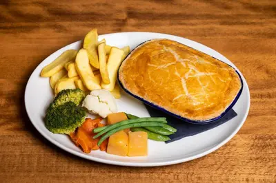 a plate of food with a sandwich and french fries at Green Hotel, a member of Radisson Individuals in Kinross