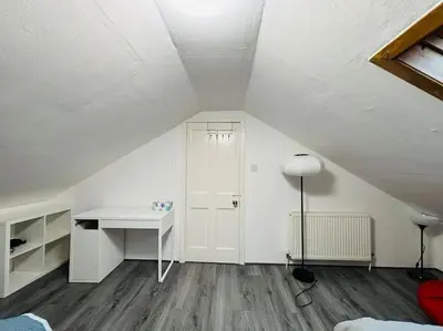 a white room with a desk and a table at Golfers lovers! Near all famous golf courses in Prestwick