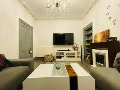 a living room with a couch and a coffee table at Golfers lovers! Near all famous golf courses in Prestwick
