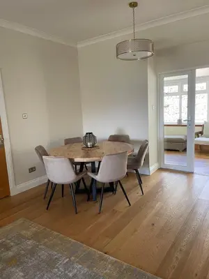a dining room with a table and chairs at Inverbeg Cottage in Rothesay