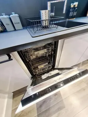 a dishwasher sitting on top of a counter at Lovely house with back garden - PRIVATE driveway in Glasgow