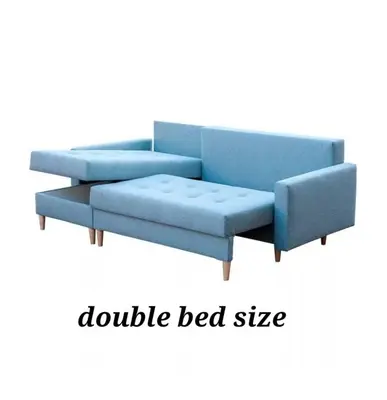 a blue couch with a blue bed size at Lovely house with back garden - PRIVATE driveway in Glasgow