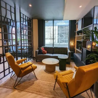 a living room with a couch and chairs and a table at Student Only Merchant Studios in Glasgow in Glasgow