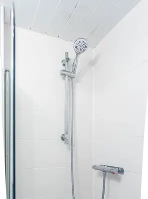 a shower with a shower head in a bathroom at 1 BDR Apt At Caledonia Luxe Stays Short Lets & Serviced Accommodation Paisley in Paisley