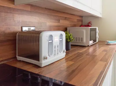 a toaster oven and microwave on a kitchen counter at 1 BDR Apt At Caledonia Luxe Stays Short Lets & Serviced Accommodation Paisley in Paisley