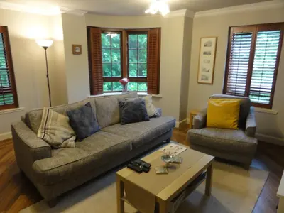 a living room with a couch and a coffee table at Orchard Brae in Edinburgh