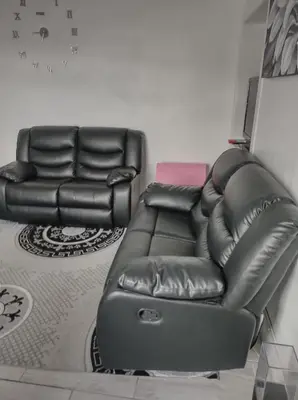 a leather recliner and a couch in a living room at Kumba in Kilmarnock