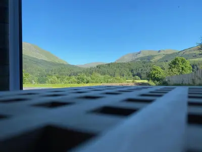a view of a keyboard with mountains in the background at The Gîte in the Highlands in Acharra