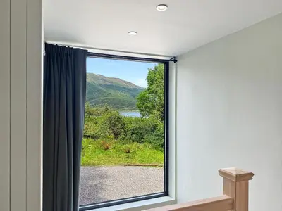 a window in a room with a view at Aos Sí - Wellness - Jacuzzi - Lodges in Ballachulish