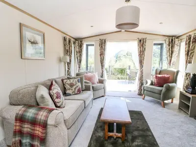a living room with a couch and a table at Saorsa in Crieff