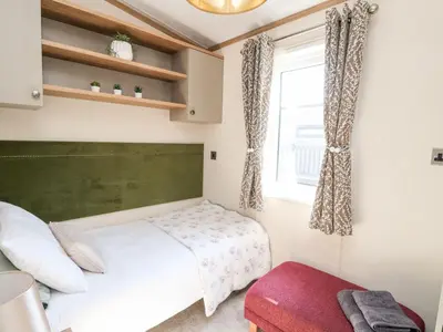 a bedroom with a bed and a window at Saorsa in Crieff