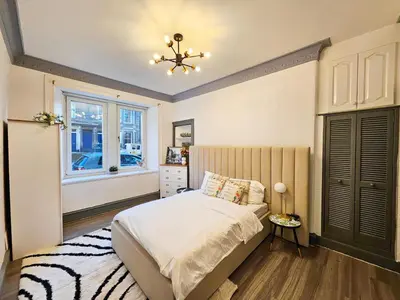 a bedroom with a bed and a window at River Haven Edinburgh in Edinburgh