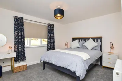 a bedroom with a bed and a window at Kilin in Lochgilphead