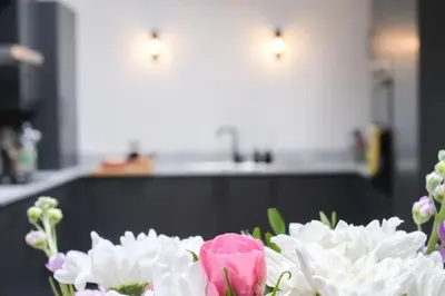 a bouquet of flowers sitting on a table at Lang Toon House - 3 bedrooms in Auchterarder