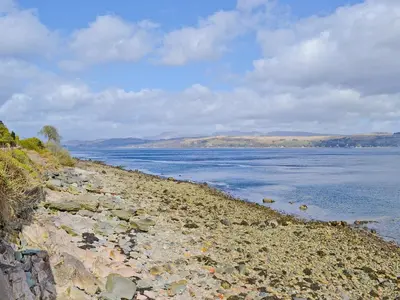 a rocky shoreline with a large body of water at Crubisdale in Blairmore