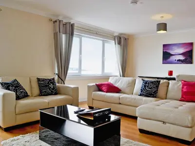 a living room with two couches and a coffee table at Seaview in Oban