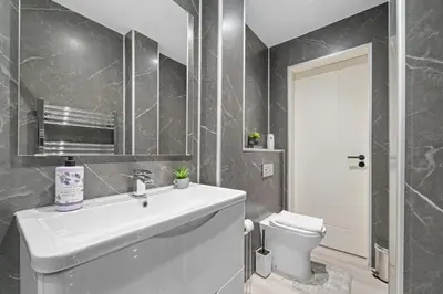 a bathroom with a sink and a toilet at Upper Grove 2 Bedroom Apartment - Edinburgh in Edinburgh