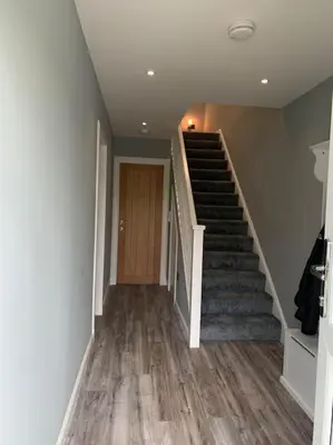 a staircase in a house with a stair case at Ardenslate House in Kirn