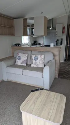 a living room with a couch and a coffee table at The Brockenhurst 25 in Dunoon