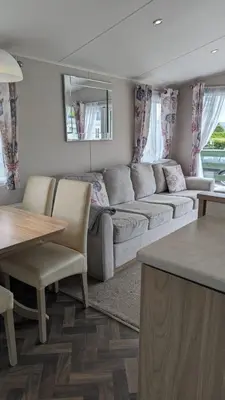 a living room with a couch and a table at The Brockenhurst 25 in Dunoon
