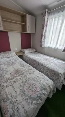 two beds in a small room with at The Brockenhurst 25 in Dunoon