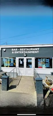a fast food restaurant with a sign on the side of a building at Turnberry Holiday Park in Turnberry