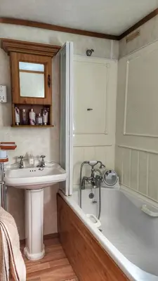 a bathroom with a tub and a sink at Turnberry Holiday Park in Turnberry
