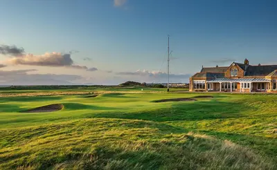 a house on a golf course with a green at Troon No 1 Apartments in Troon