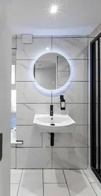 a bathroom with a sink and a mirror at The Bayview, Rothesay, Isle of Bute in Rothesay
