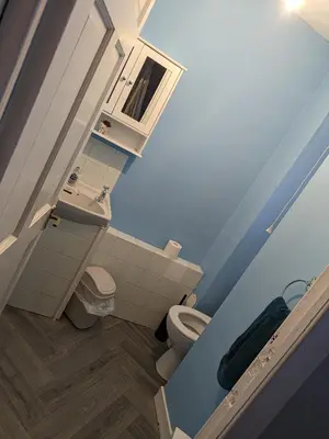 a small bathroom with a toilet and a sink at 4 bedroom Townhouse Greenock in Greenock